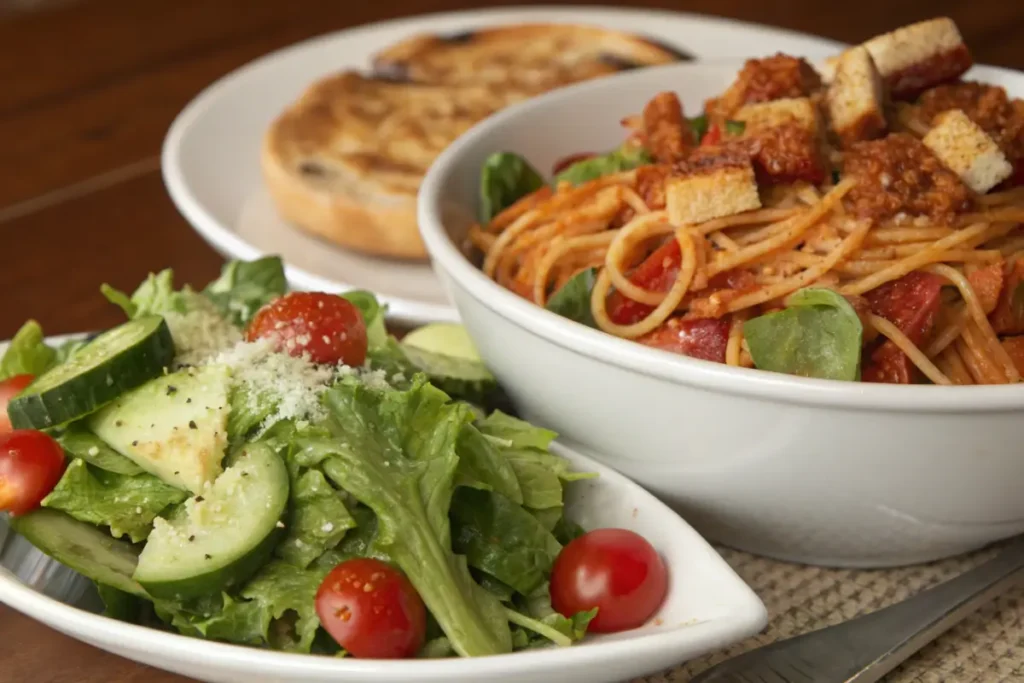 Fresh green salad served with chicken spaghetti with Rotel